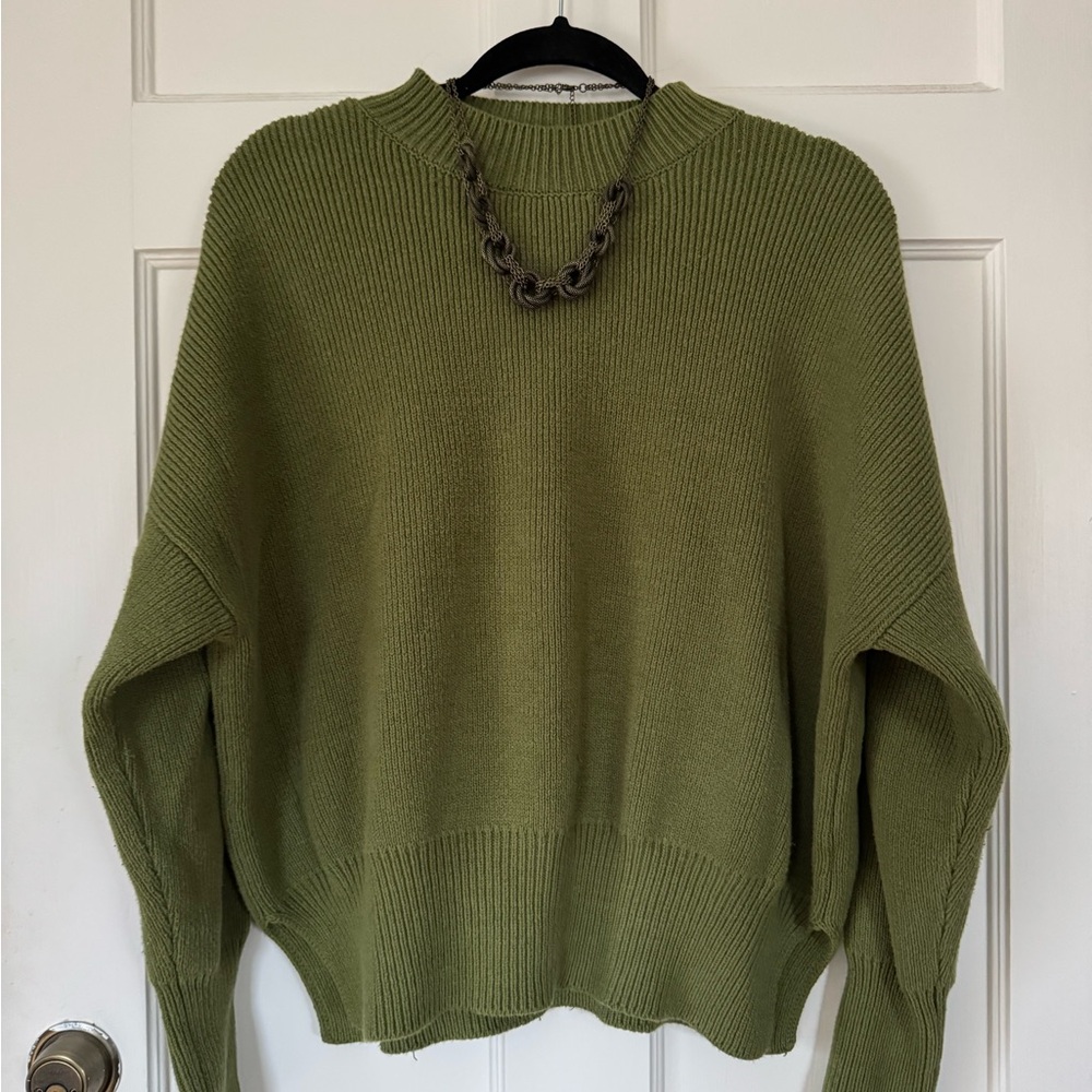 Green knit sweater. Gently worn, great condition.